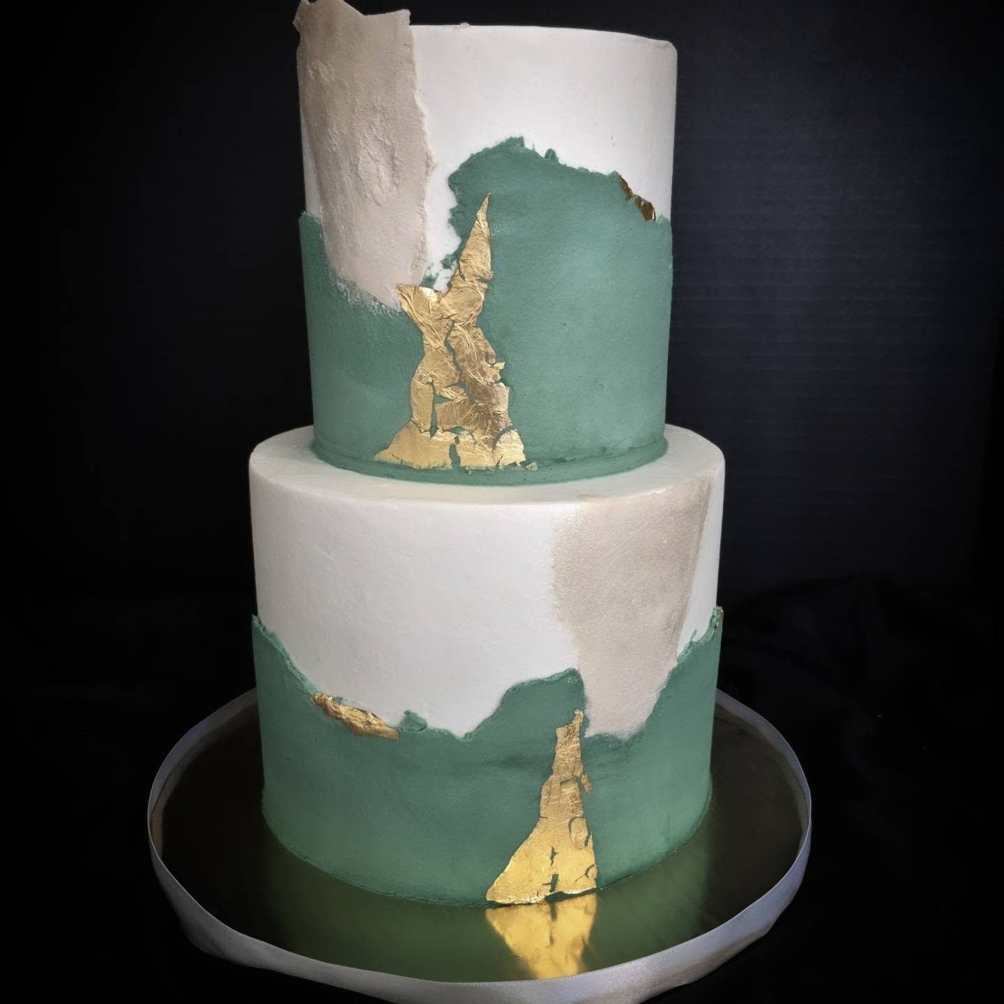 Three-tier wedding cake with flowers
